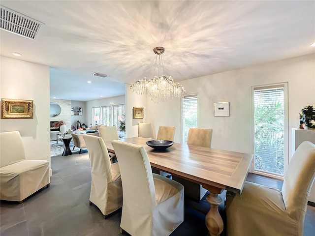 dining space with a chandelier