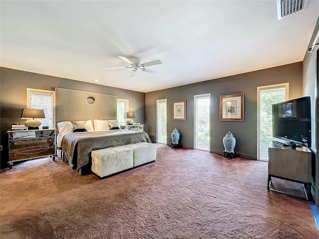 carpeted bedroom with ceiling fan