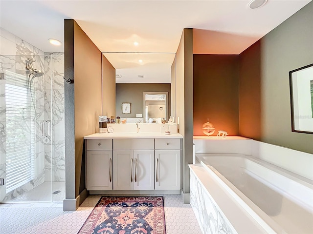 bathroom featuring tile patterned floors, vanity, and independent shower and bath