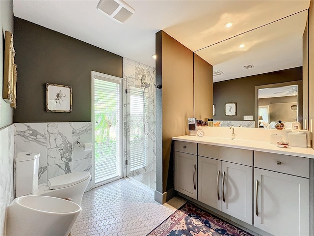 bathroom with vanity, a bidet, a shower with shower door, tile patterned floors, and toilet