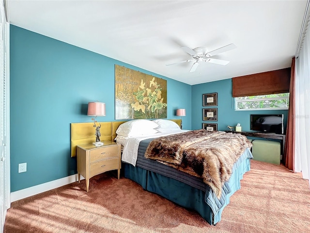 carpeted bedroom featuring a closet and ceiling fan