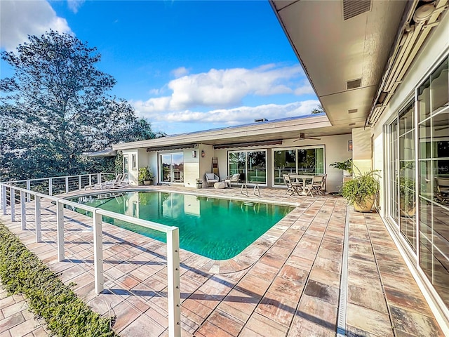 view of swimming pool featuring a patio