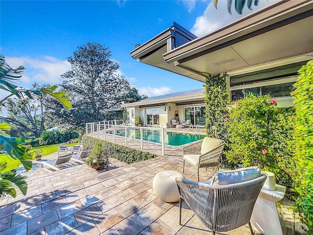 exterior space featuring an outdoor hangout area and a patio area