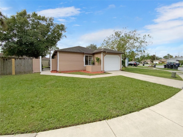 view of front of home with a garage and a front lawn