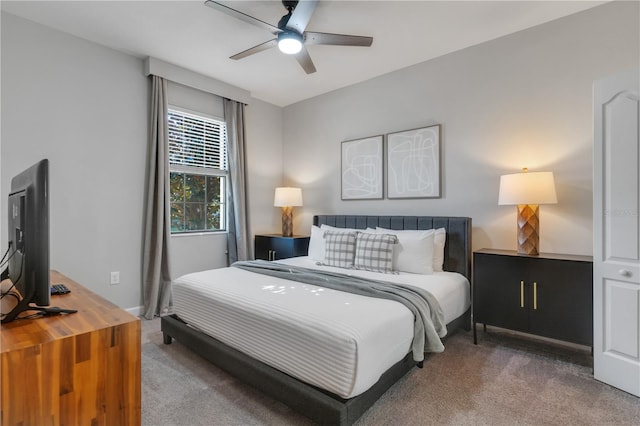 bedroom featuring ceiling fan and carpet