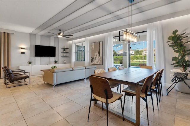 dining room with light tile patterned floors and ceiling fan with notable chandelier