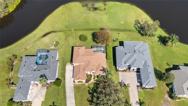 birds eye view of property with a water view