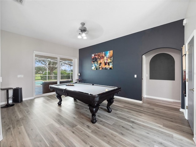 playroom with light hardwood / wood-style floors, pool table, and ceiling fan