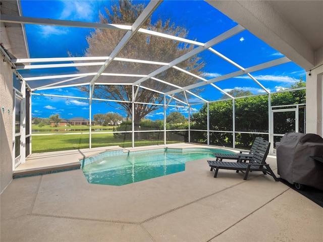 view of pool featuring a patio, grilling area, and glass enclosure