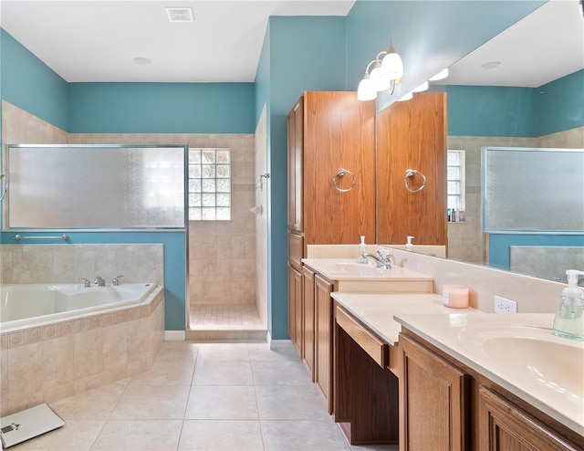 bathroom with vanity, independent shower and bath, and tile patterned floors