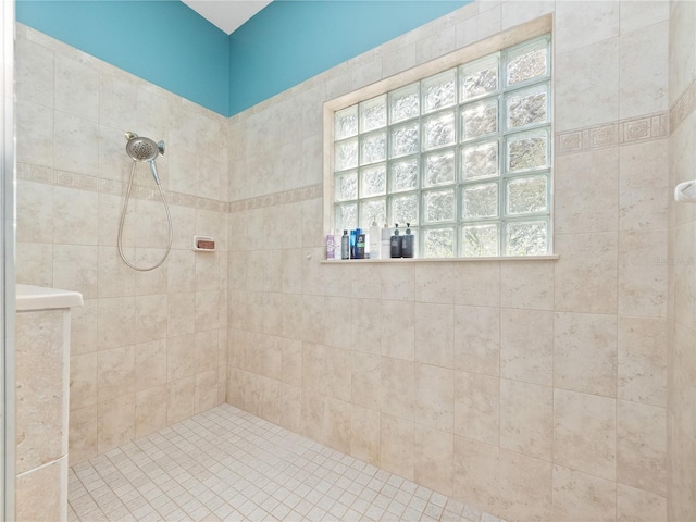 bathroom with a tile shower