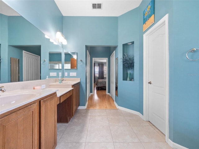 bathroom with vanity and tile patterned flooring