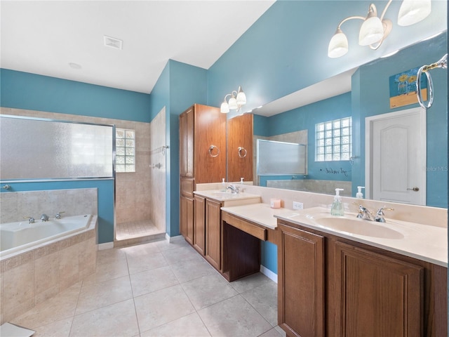 bathroom featuring vanity, shower with separate bathtub, and tile patterned flooring