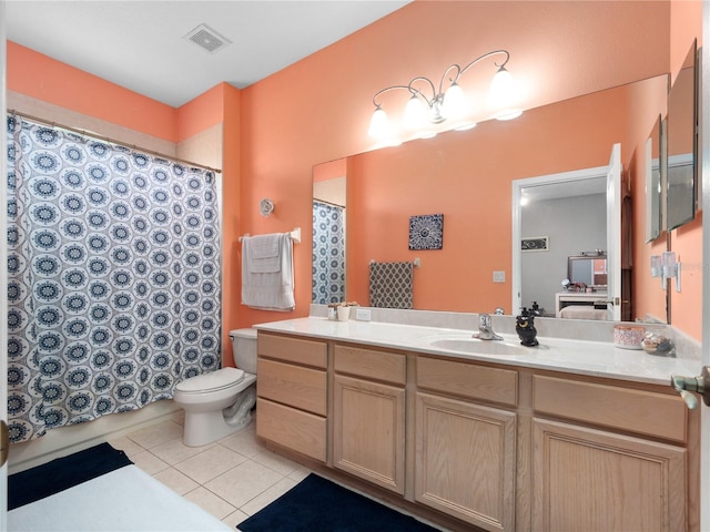 bathroom featuring walk in shower, vanity, toilet, and tile patterned floors