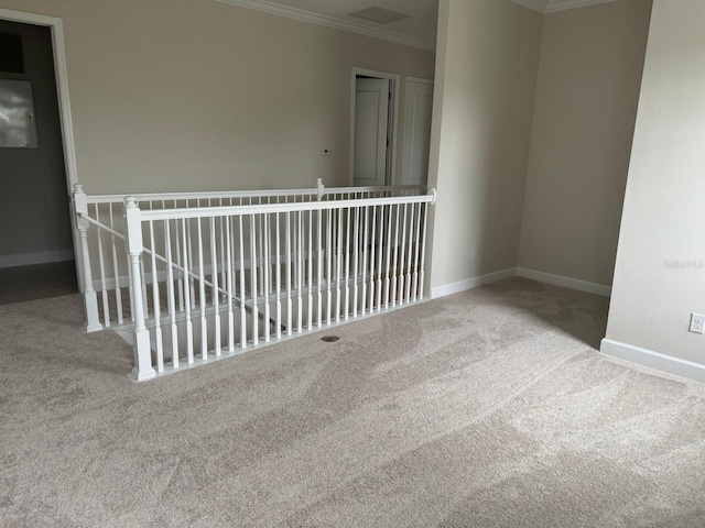 carpeted empty room with ornamental molding