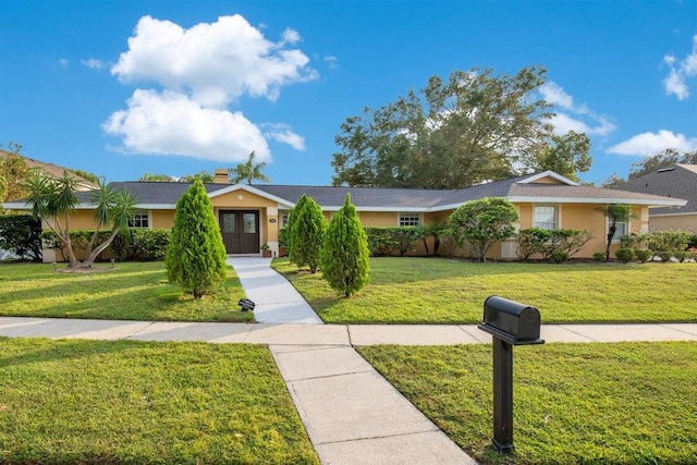 ranch-style home with a front yard