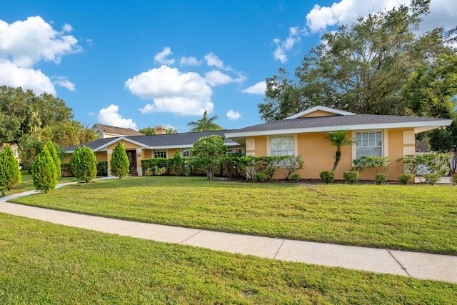 single story home featuring a front lawn