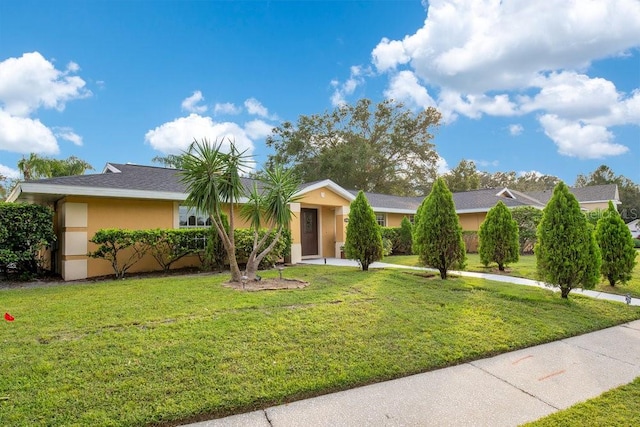 single story home with a front yard