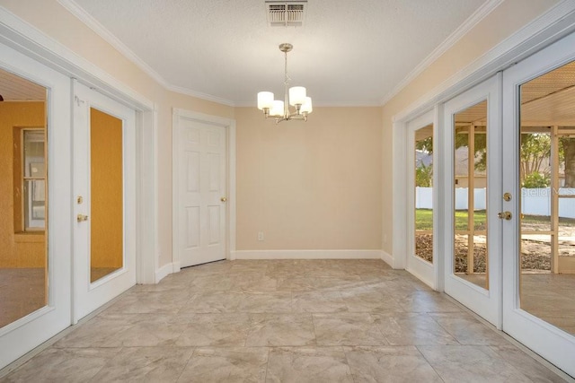 interior space featuring a wealth of natural light, french doors, and crown molding