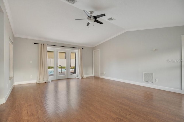 empty room with lofted ceiling, french doors, ornamental molding, hardwood / wood-style floors, and ceiling fan