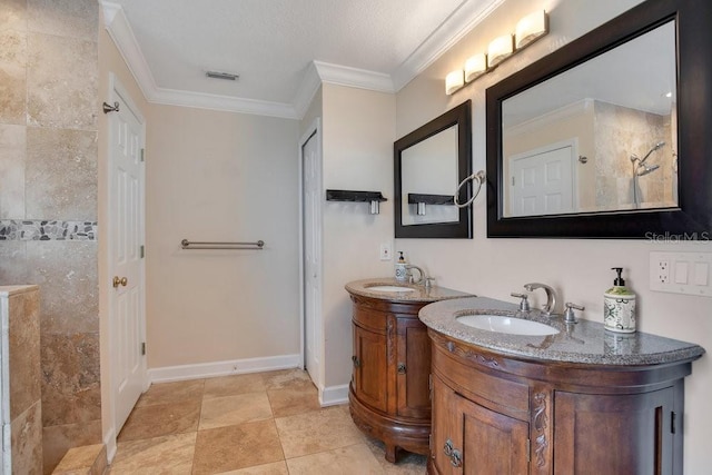 bathroom featuring a tile shower, ornamental molding, and vanity