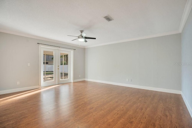 unfurnished room featuring french doors, ornamental molding, hardwood / wood-style floors, a textured ceiling, and ceiling fan