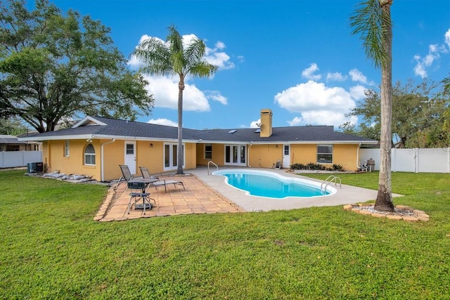 view of pool featuring a yard and a patio area