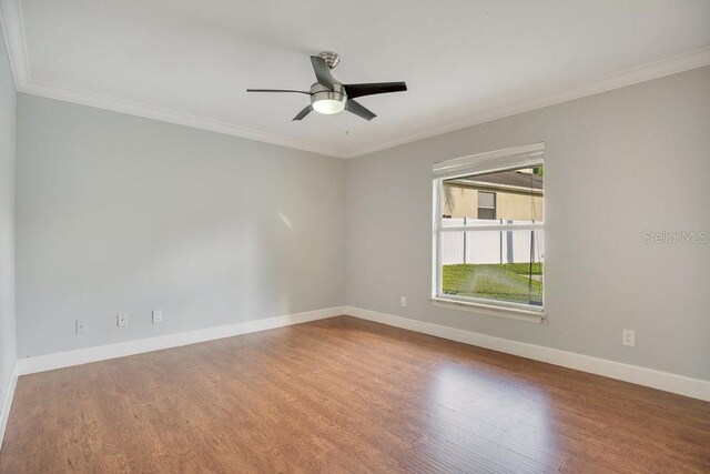 unfurnished room with ornamental molding, hardwood / wood-style flooring, and ceiling fan