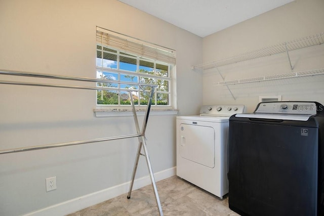 laundry area featuring washer and clothes dryer