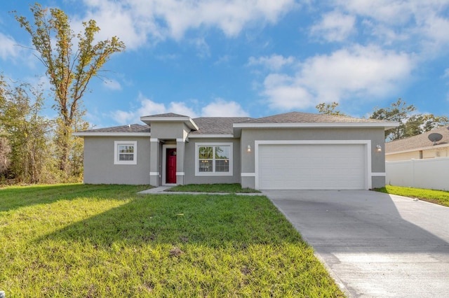 view of front of house featuring a front yard and a garage