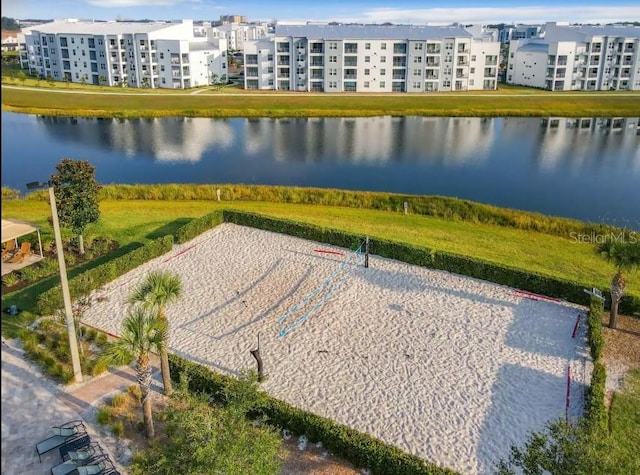 birds eye view of property with a water view