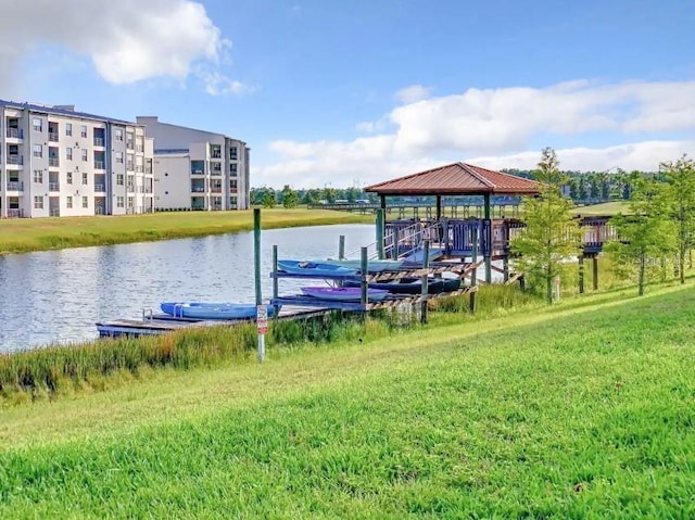 dock area featuring a water view and a lawn