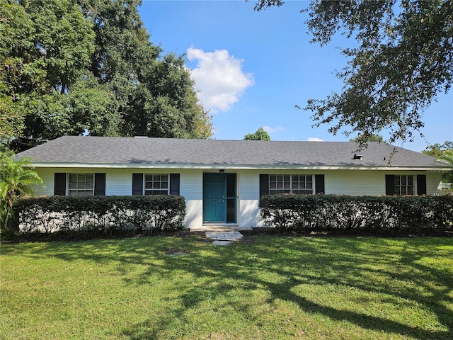 ranch-style home with a front yard