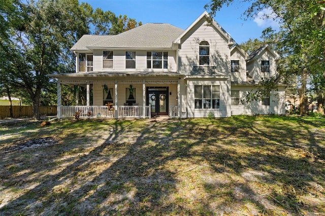 view of front of home featuring a front lawn and a porch