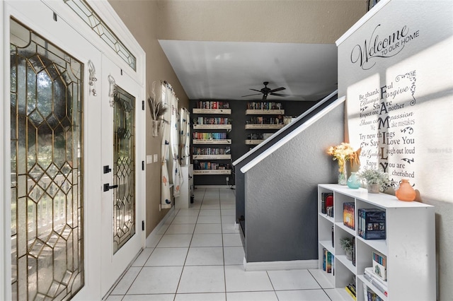 entrance foyer with ceiling fan and light tile patterned floors