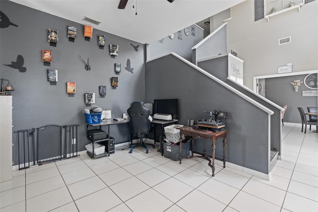 tiled office space with ceiling fan