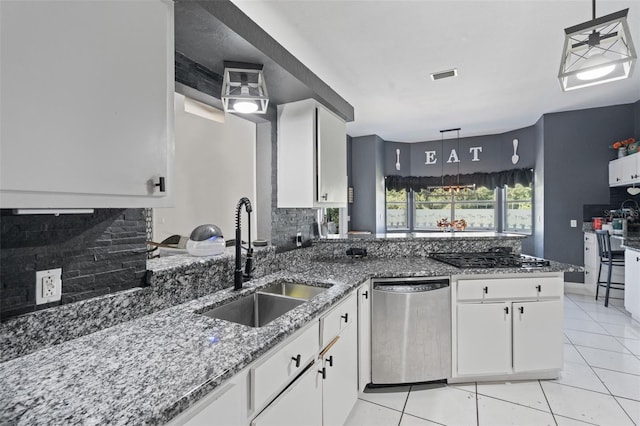 kitchen with white cabinetry, dishwasher, and decorative light fixtures