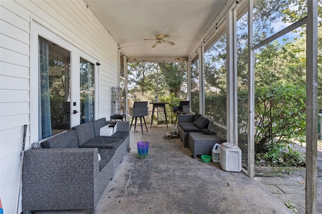 sunroom / solarium featuring ceiling fan