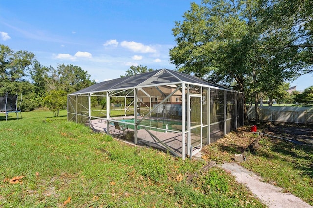 exterior space with a trampoline and a lanai