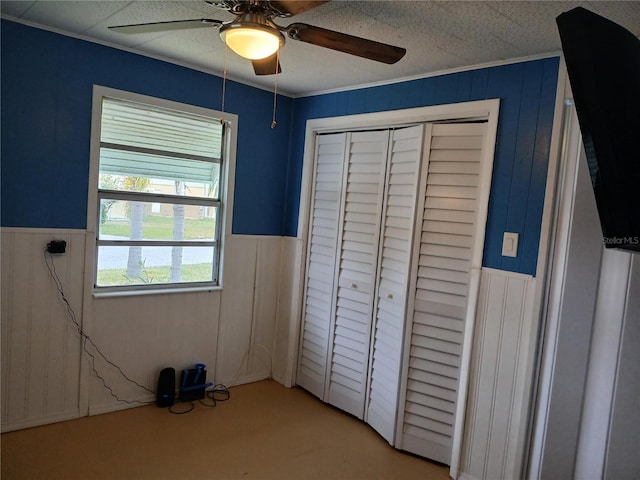 unfurnished bedroom with a closet and ceiling fan