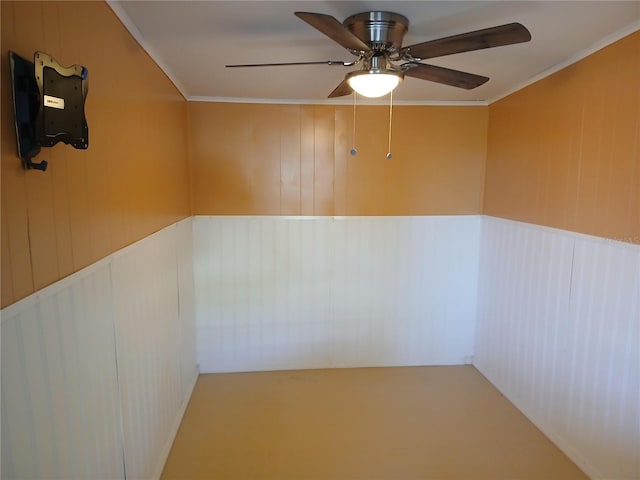 interior space featuring ceiling fan and ornamental molding