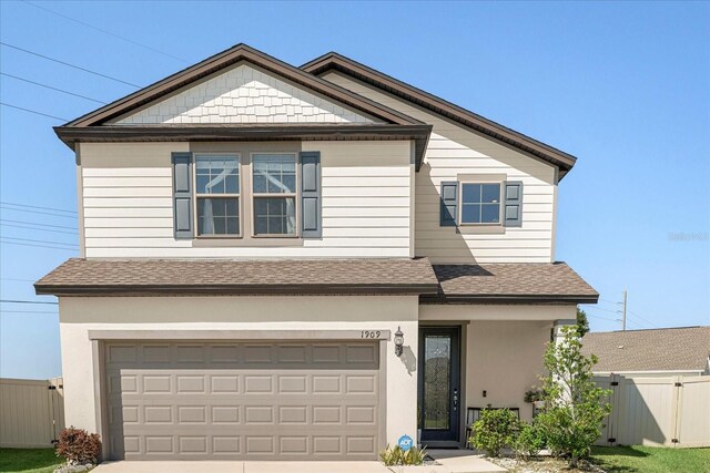 1909 Cayman Cove Cir, Saint Cloud, FL 34772 - view of front of property featuring an attached garage, fence, driveway, and a shingled roof