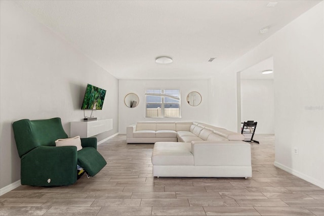 living room featuring light wood-type flooring