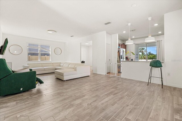 1909 Cayman Cove Cir, Saint Cloud, FL 34772 - living area with recessed lighting, light wood-type flooring, visible vents, and baseboards