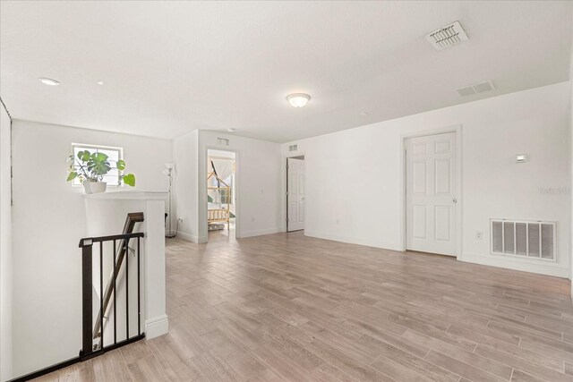1909 Cayman Cove Cir, Saint Cloud, FL 34772 - unfurnished room featuring visible vents, light wood finished floors, and baseboards