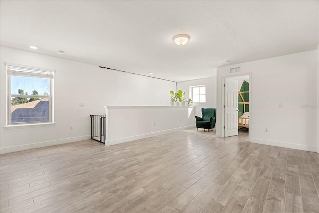 empty room with light wood-type flooring