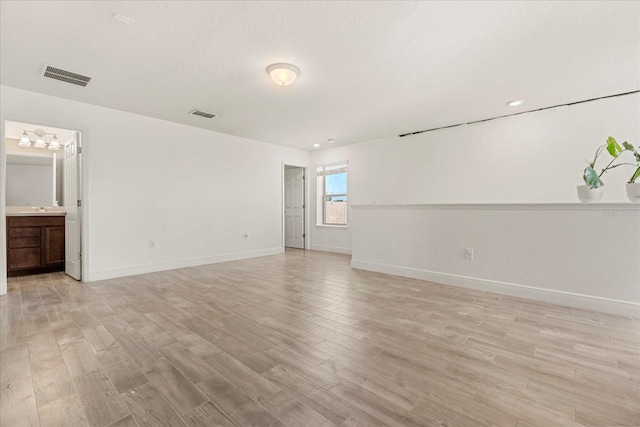 empty room with light wood-type flooring