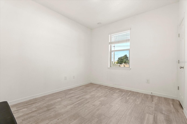 unfurnished room with light hardwood / wood-style floors