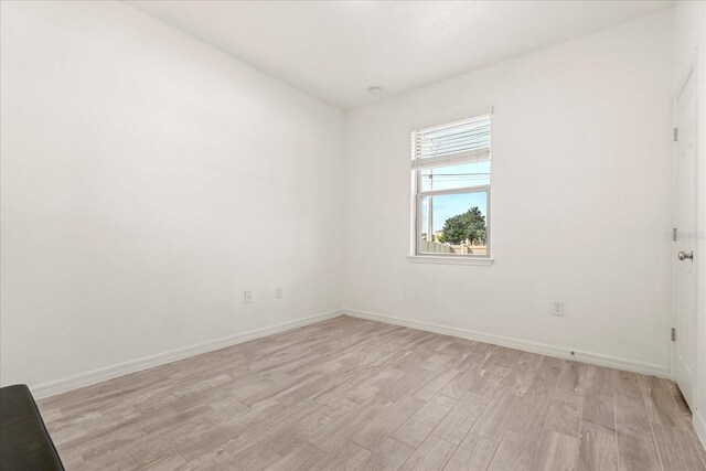1909 Cayman Cove Cir, Saint Cloud, FL 34772 - unfurnished room featuring light wood-style flooring and baseboards