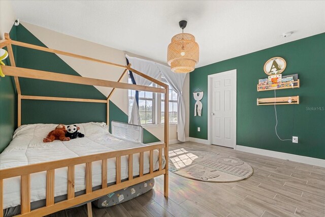 1909 Cayman Cove Cir, Saint Cloud, FL 34772 - bedroom featuring wood finished floors and baseboards